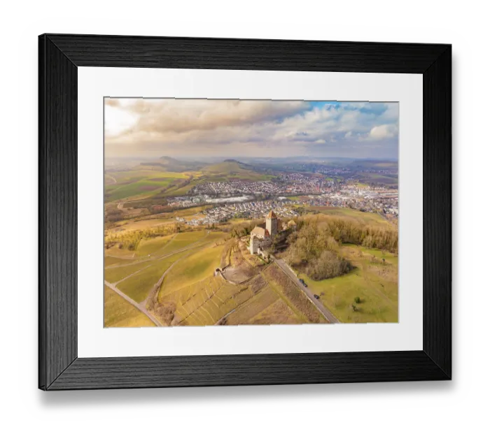 Framed Print : A castle stands above the fields and the village