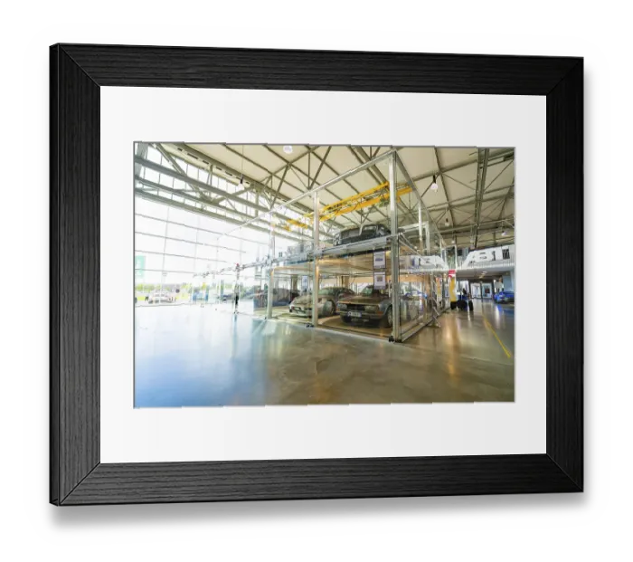 Framed Print : Large room with glass garage and several cars