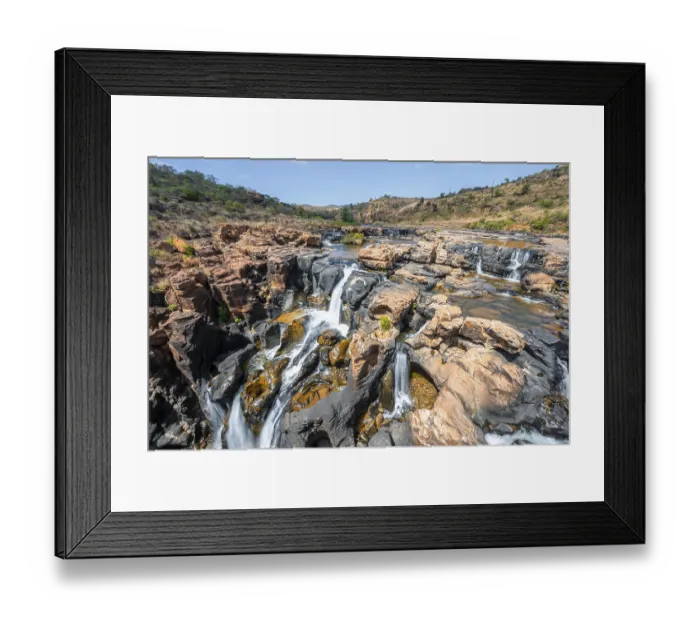 Framed Print : Waterfall on orange-coloured rock cliffs Framed Print : Waterfall on orange-coloured rock cliffs
