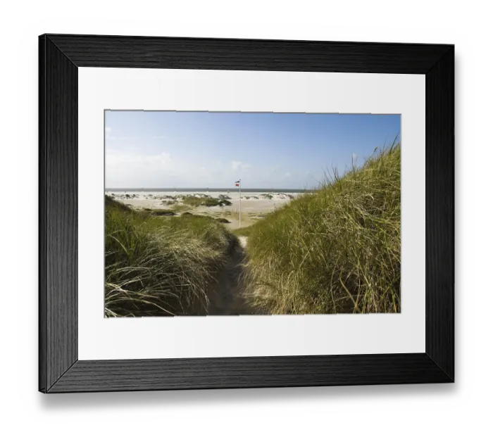 Framed Print : Dune landscape in front of a blue sky on the beach of Norddorf on the North Frisian island of Amrum