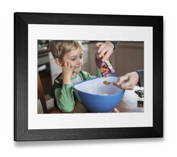 Framed Print : 6 years old boy looking on preparing Christmas cake