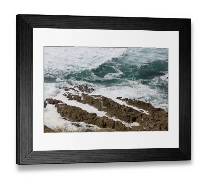 Framed Print : Waves break on the rocky coast off the bay of Greve de Dalbosc