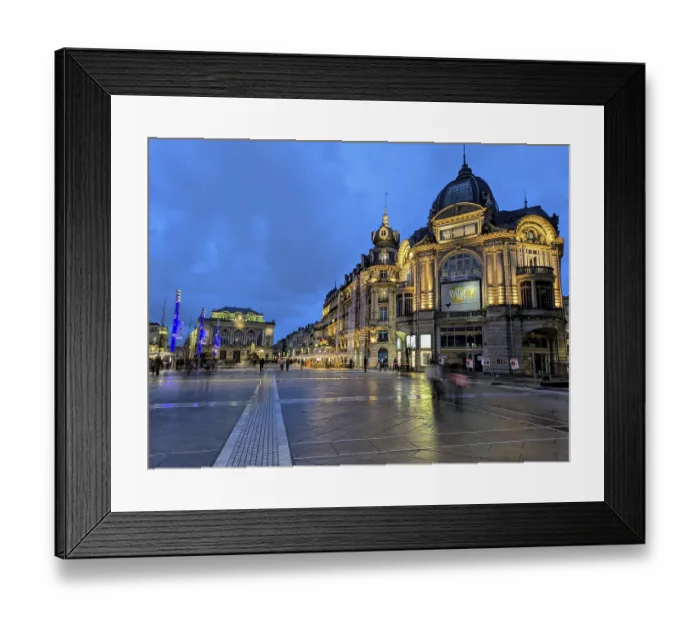Framed Print : Illuminated cityscape at dusk with historic buildings and a deep blue sky