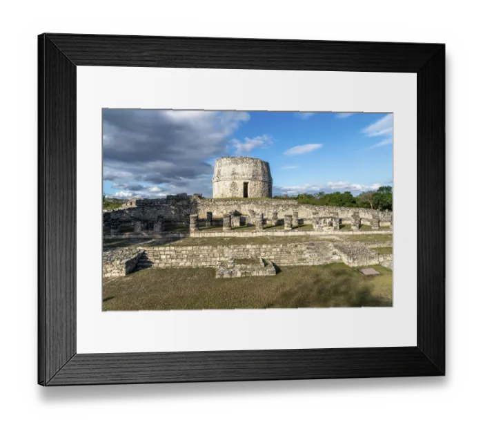 Framed Print : Round stone tower in archaeological site with Mayan ruins and cloudy sky