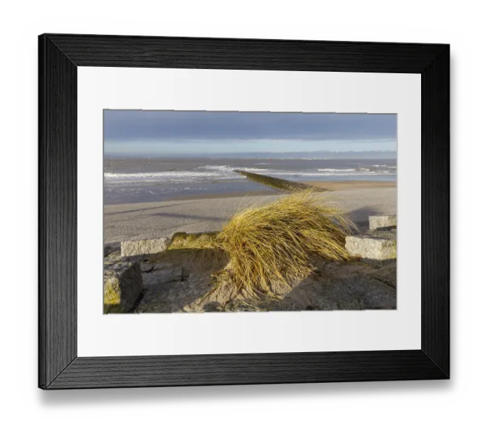 Framed Print : Paved beach promenade and groyne on the west beach of Norderney Framed Print : Paved beach promenade and groyne on the west beach of Norderney
