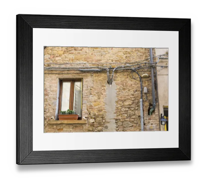 Framed Print : House wall with exposed power cables