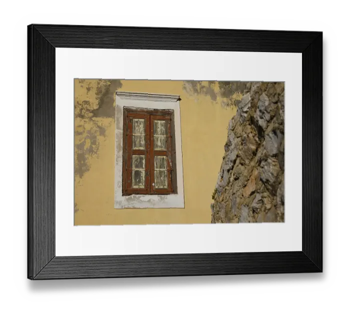 Framed Print : An old, weathered window in a yellow wall
