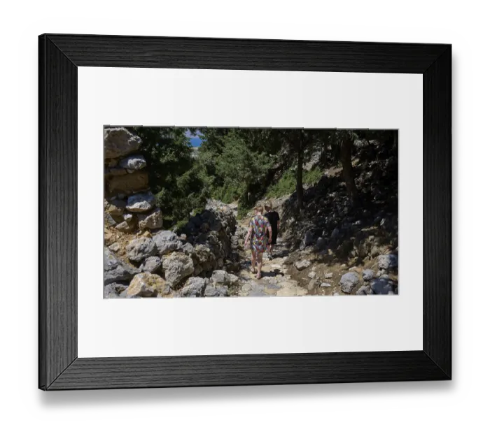 Framed Print : Two people walking on a stony path through a forest on a sunny day Framed Print : Two people walking on a stony path through a forest on a sunny day