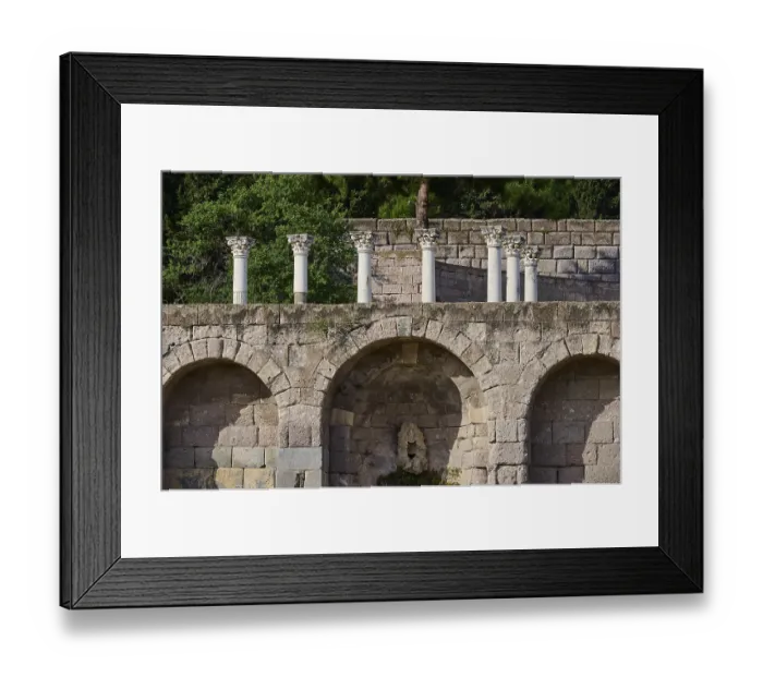 Framed Print : Ancient stone structure with columns and overgrown trees in the background Framed Print : Ancient stone structure with columns and overgrown trees in the background