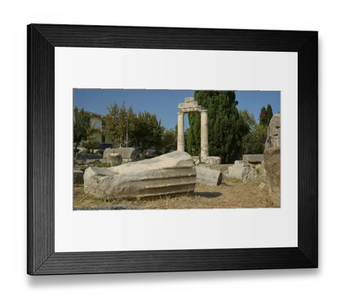 Framed Print : Debris of a fallen column lying on dry ground in front of a stone archway Framed Print : Debris of a fallen column lying on dry ground in front of a stone archway