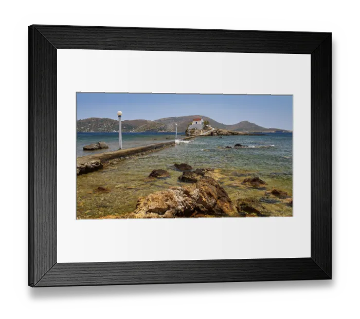 Framed Print : Rocky coastal landscape with lonely chapel