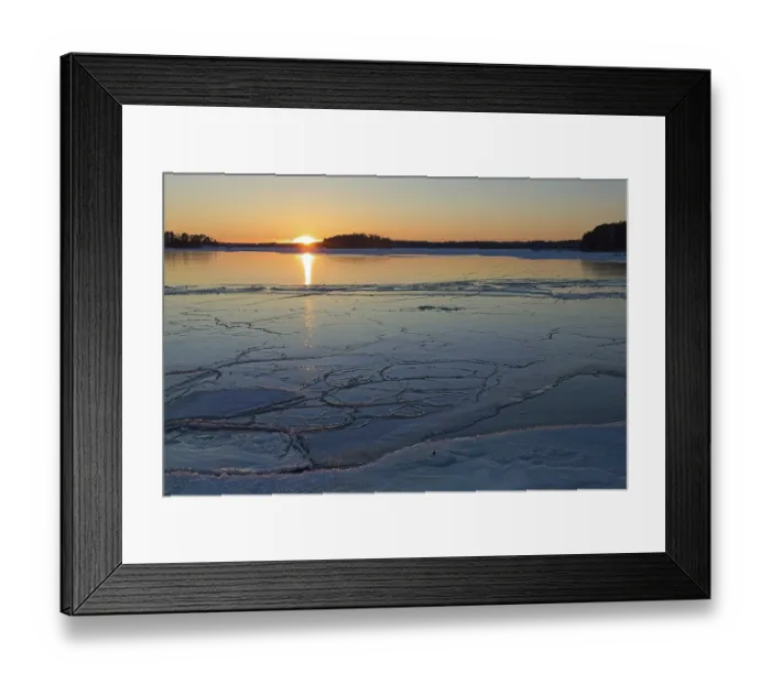 Framed Print : Scenic view of seashore at sunset in winter with frozen sea