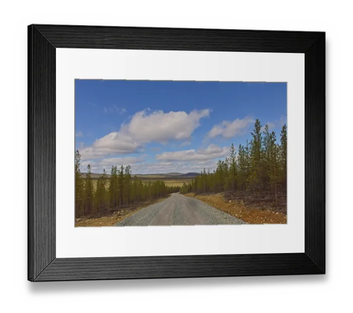 Framed Print : A gravel road landscape at Raja-Jooseppi in spring with clouds in the sky