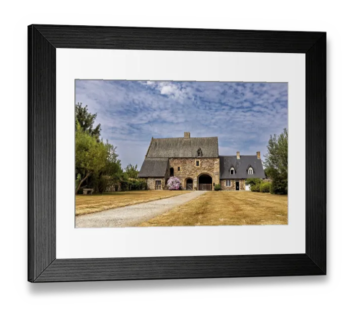 Framed Print : An old stone house with a gravelled path and a blue sky