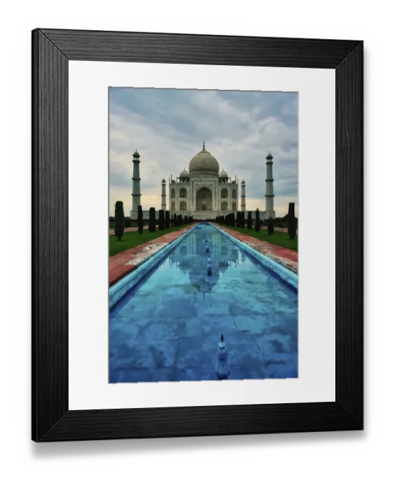 Framed Print : Taj Mahal reflected in water under a cloudy sky