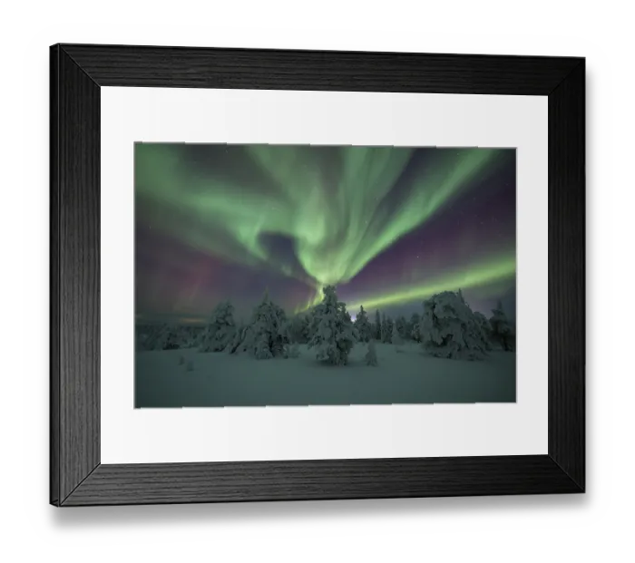 Framed Print : Northern lights over winter landscape