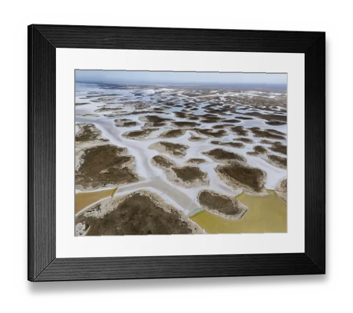 Framed Print : Extensive salt lakes and branched water on a desert-like area