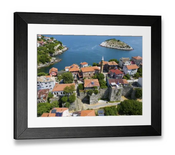 Framed Print : Coastal town with historic tower