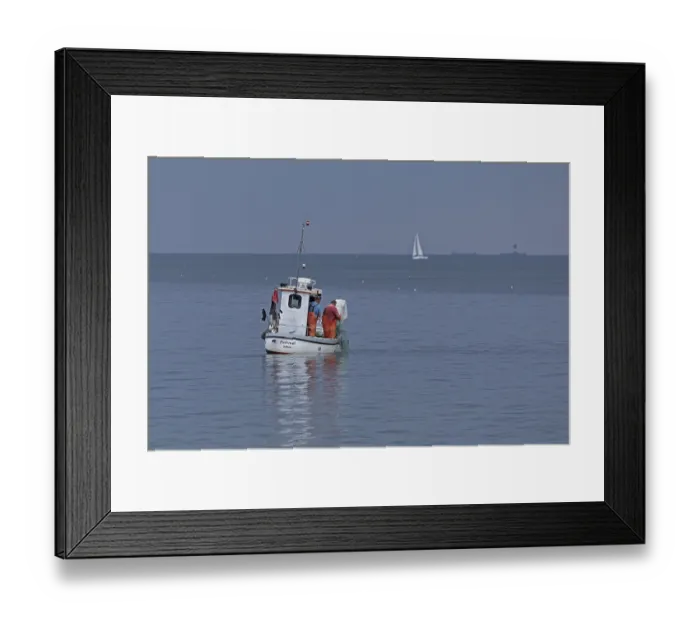 Framed Print : Fishing boat off Falckenstein Strand