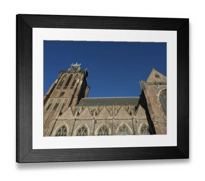 Framed Print : Gothic church with brick structure and high tower