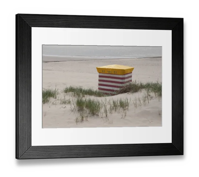 Framed Print : Lonely striped beach chair on the sandy shore with sea view