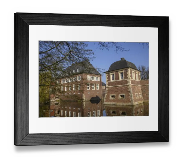 Framed Print : Historic moated castle with impressive reflection in the water