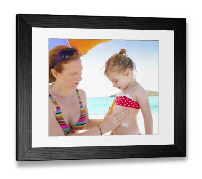 Framed Print : Daughter and mother in beach with sunscreen in bikini Framed Print : Daughter and mother in beach with sunscreen in bikini