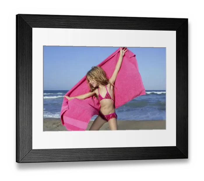 Framed Print : Beach little girl playing pink towel and wind in blue sea