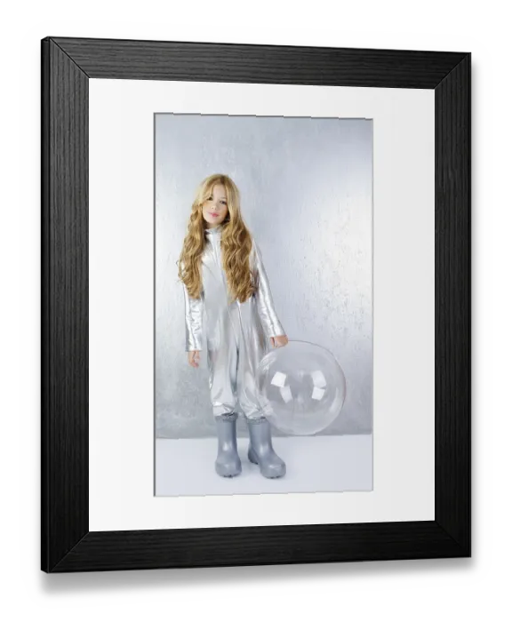 Framed Print : Astronaut futuristic kid girl with silver full length uniform and glass bubble helmet
