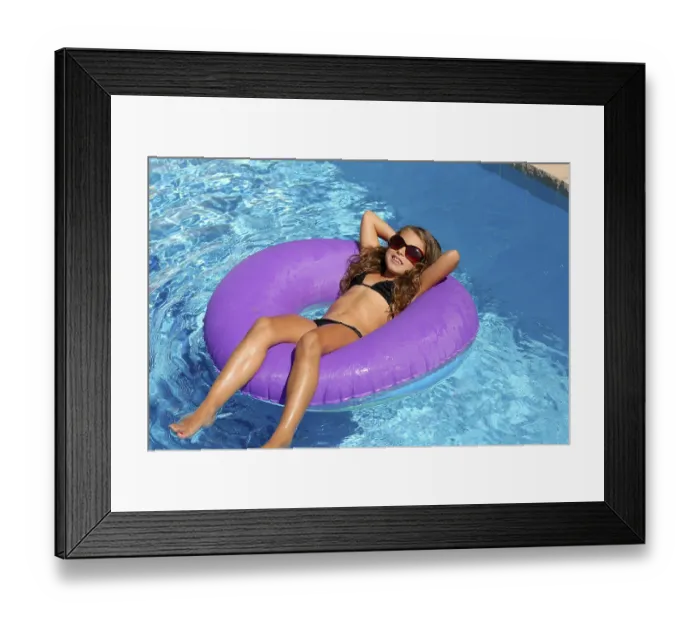 Framed Print : Bikini children girl with sunglasses relaxed on purple inflatable pool ring