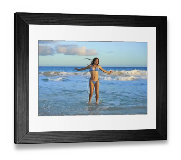 Framed Print : Latin beautiful bikini girl happy jumping in Caribbean beach sunset