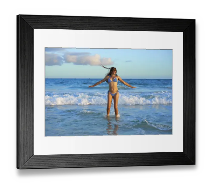 Framed Print : Latin beautiful bikini girl happy jumping in Caribbean beach sunset