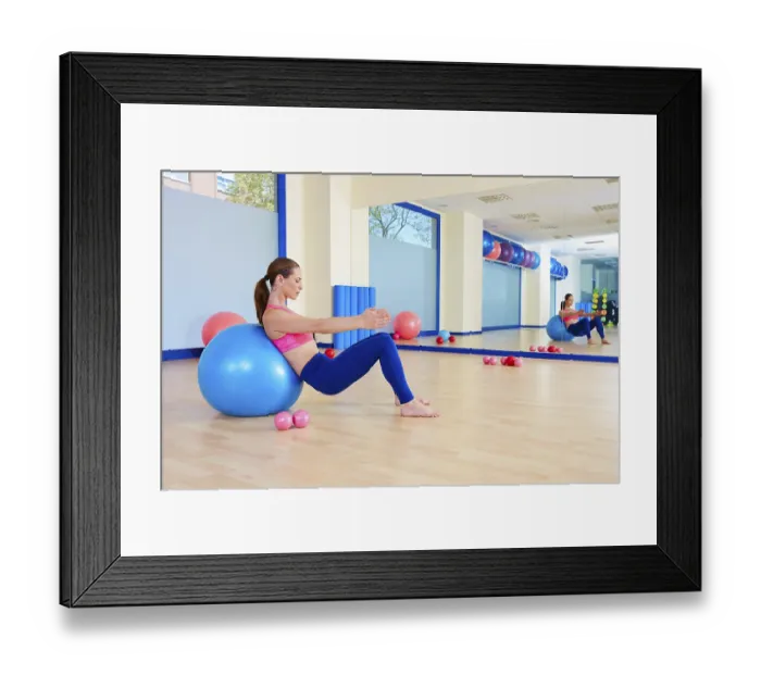 Framed Print : Pilates woman fitball swiss ball exercise workout at gym indoor Framed Print : Pilates woman fitball swiss ball exercise workout at gym indoor