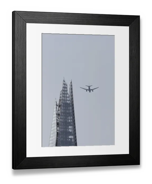 Framed Print : Jet passenger aircraft in flight over The Shard skyscraper building