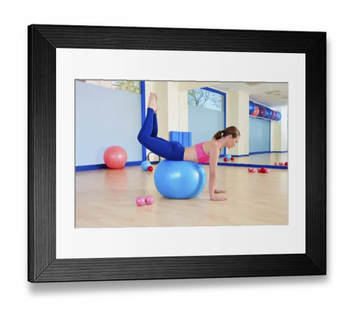 Framed Print : Pilates woman fitball rocking exercise workout at gym indoor Framed Print : Pilates woman fitball rocking exercise workout at gym indoor