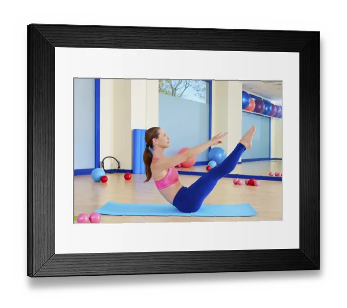 Framed Print : Pilates woman teaser exercise workout at gym indoor