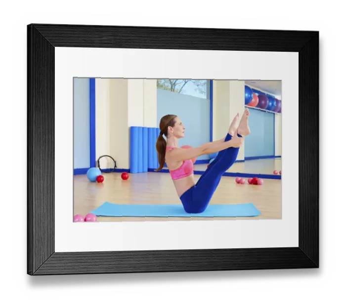 Framed Print : Pilates woman open leg rocker exercise workout at gym indoor