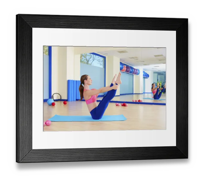 Framed Print : Pilates woman open leg rocker exercise workout at gym indoor