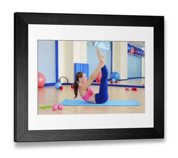 Framed Print : Pilates woman scissor exercise workout at gym indoor
