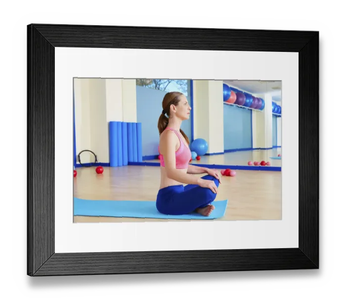 Framed Print : Pilates woman stretching exercise workout at gym indoor
