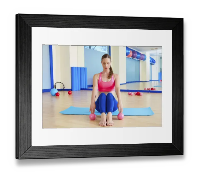 Framed Print : Pilates woman sand balls exercise workout at gym indoor Framed Print : Pilates woman sand balls exercise workout at gym indoor