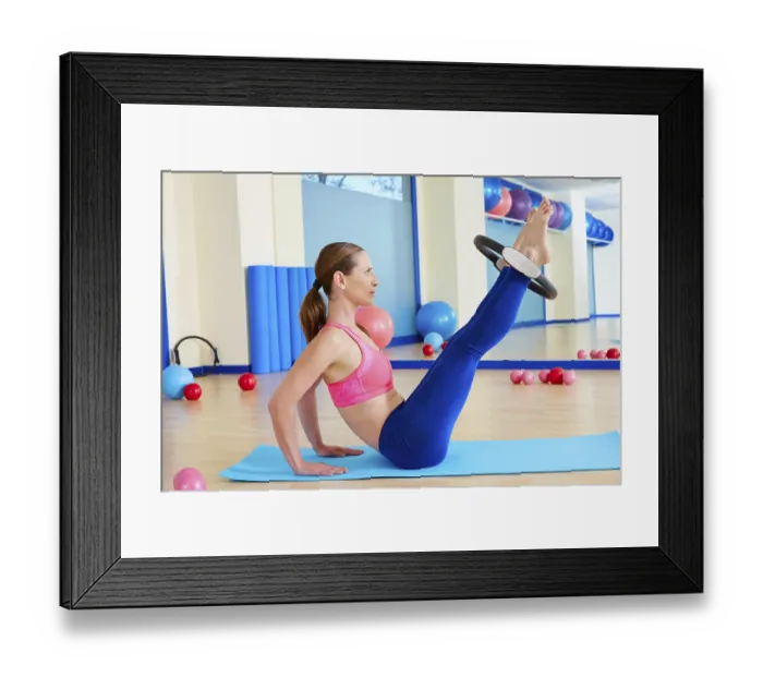 Framed Print : Pilates woman hip twist magic ring exercise workout at gym indoor Framed Print : Pilates woman hip twist magic ring exercise workout at gym indoor