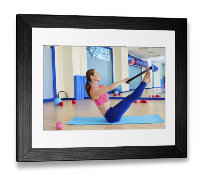 Framed Print : Pilates woman teaser magic ring exercise workout at gym indoor