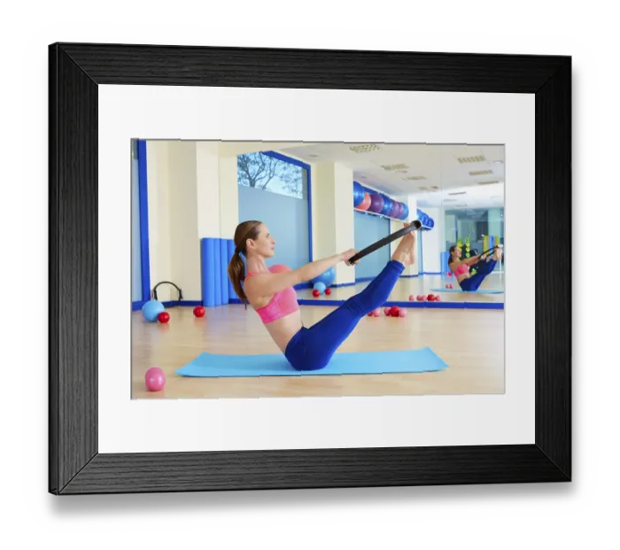 Framed Print : Pilates woman teaser magic ring exercise workout at gym indoor