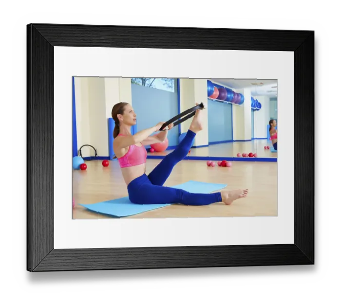 Framed Print : Pilates woman scissor magic ring exercise workout at gym indoor Framed Print : Pilates woman scissor magic ring exercise workout at gym indoor