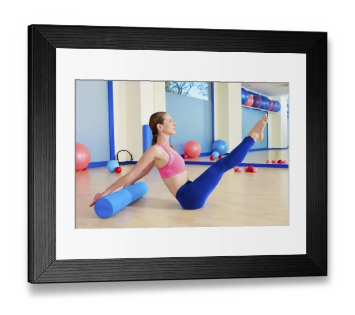 Framed Print : Pilates woman roller teaser roll exercise workout at gym indoor