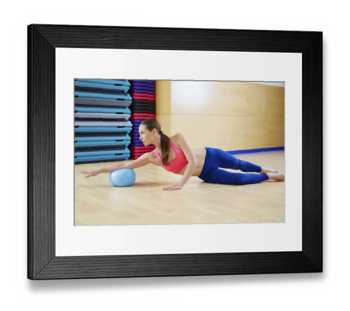 Framed Print : Pilates woman stability ball exercise workout at gym indoor Framed Print : Pilates woman stability ball exercise workout at gym indoor
