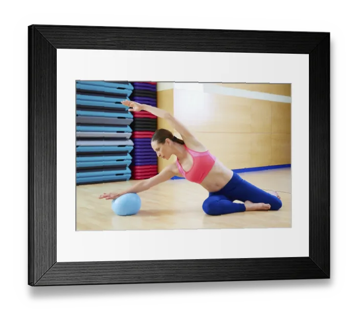Framed Print : Pilates woman mermaid stability ball exercise workout at gym indoor Framed Print : Pilates woman mermaid stability ball exercise workout at gym indoor