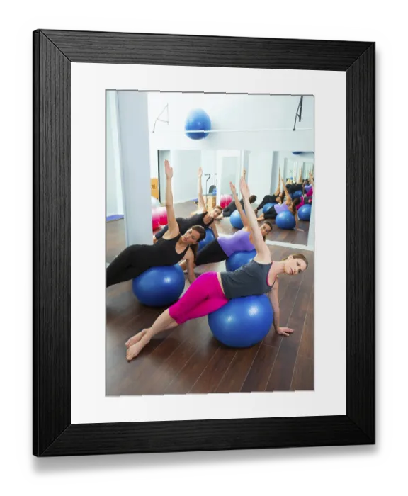 Framed Print : Aerobic Pilates women group with stability ball in a row on mirror gym
