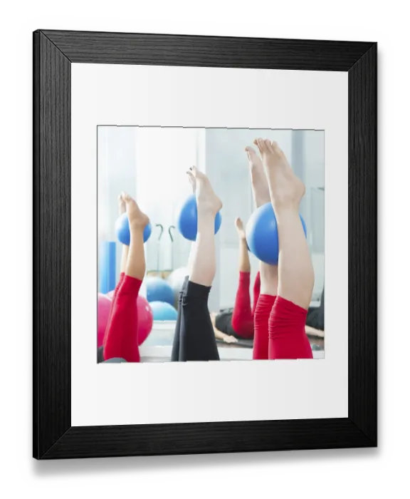 Framed Print : Aerobics pilates women feet with yoga balls in a row on fitness class
